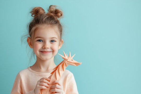Joyful Child with Paper Dragon: A beaming child with a captivating smile tenderly holds a handcrafted origami dragon. The image exudes pure childhood innocence and imaginative play.