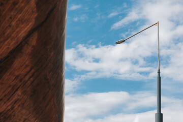 Minimal Streetlight Against Blue Sky with Clouds