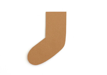 Blank brown Christmas stocking shape cut from cardboard - isolated