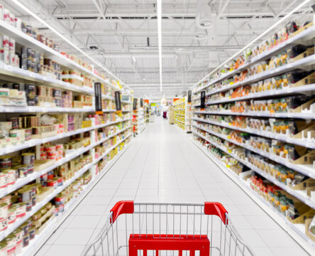 empty grocery cart in an empty supermarket