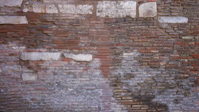 Weathered brick and limestone wall texture in sharp detail, suitable for wall and architectural use outdoor; background backplate copyspace calm.