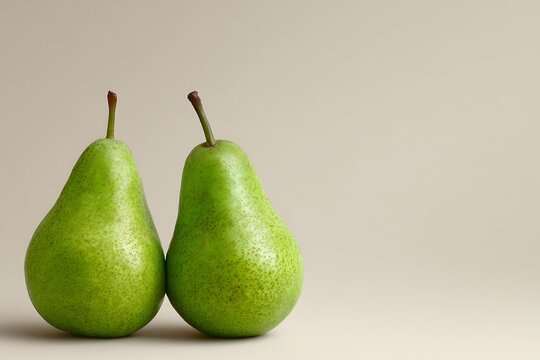 Two green pears standing together on plain background - Powered by Adobe