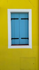 Blue window on yellow wall, Burano, Italy