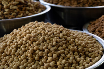 Roasted Hazelnuts on Market Stall. Freshly Roasted Hazelnuts for Sale at Local Market. Traditional Market Stall Selling Roasted Hazelnuts.