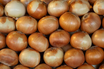 Fresh Onions at a Market Stall. Ripe Onions Ready to Sell. Organic Onions in a Farmer’s Market.