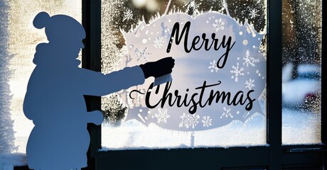 Silhouette paints Merry Christmas onto frosted window. Winter scene visible outside, snowy landscape. Festive holiday decoration.