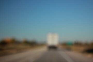 An abstract view of a truck driving on highway