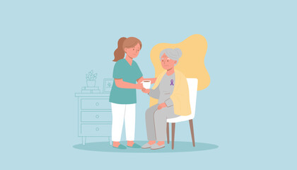 Professional caregiver assists senior woman with a warm drink illustrating home healthcare support