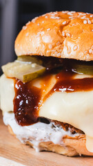 Korean fried chicken katsu burger with panko-crusted thigh, brioche bun, special sauces, pickles, and cheese. Crispy, juicy, and packed with flavor. Asian fusion delight.