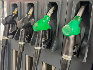 Modern, clean gas station with multiple fuel pumps and convenience store entrance, ideal for themes of travel, transportation, and energy infrastructure