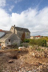 Rustic Stone Building With Green Shutters Overlooking Garden And Clear Blue Sky, Grohote, Solta
