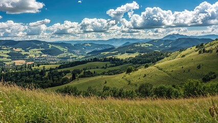 Fototapeta premium Lush green rolling hills and mountains under a partly cloudy sky, vibrant and scenic landscape.