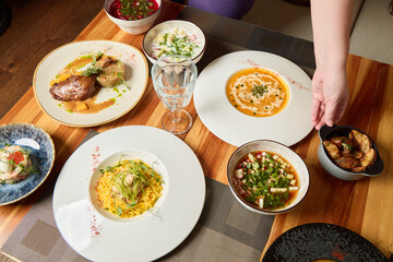 An Enchanting Array of Delicious Dishes Beautifully Displayed on a Rustic Wooden Table