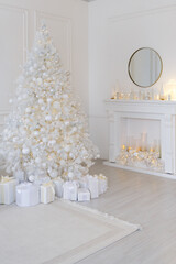 White Christmas interior with decorated tree, glowing garlands, candles, white gifts, elegant festive decor, and a round mirror above a white fireplace.