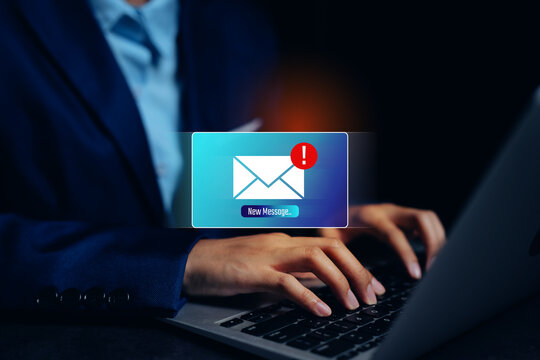 Hands typing laptop with message alert, communication priority, workflow awareness, digital correspondence, timely response habit, productivity reminder concept