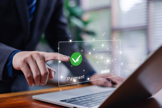A secure online payment interface displayed on a laptop as a user touches a digital verification icon, symbolizing safe transactions, fintech security, and modern digital financial solutions.