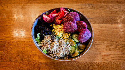 Vibrant Vegan Buddha Bowl with Quinoa, Falafel, and Fresh Vegetables
