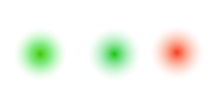 Three blurred glowing orbs of light in green and red against a black background