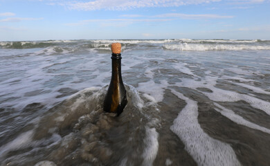 bottle found on the beach sealed with a cork containing a secret message or a treasure map
