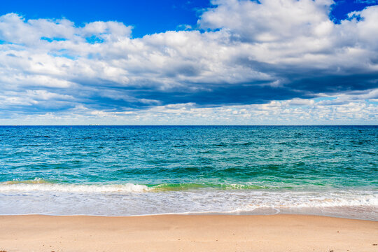waves gently crashing on sandy beach
