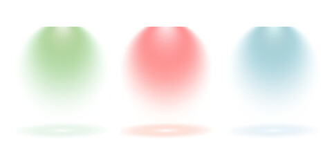 Three colorful spotlights shining down on a dark stage creating bright beams of light