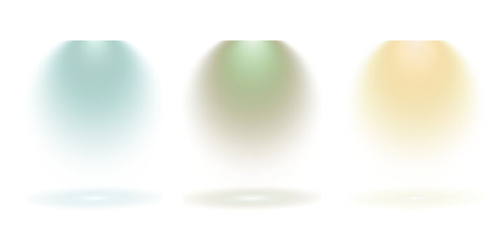 Three distinct colored spotlights illuminating a dark background with soft light beams