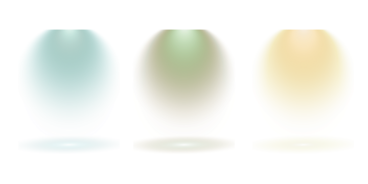 Three distinct colored spotlights illuminating a dark background with soft light beams