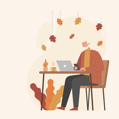 Mature man working remotely on a laptop during autumn illustrating modern freelance and productivity