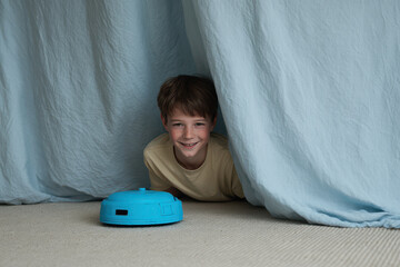 cheerful robot vacuum is playfully hiding behind couch engaging in fun game of hideandseek with giggling child