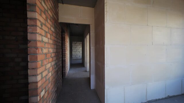 Interior of unfinished apartment with brick and block walls