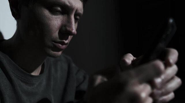 Man writing apology message on smartphone, emotional breakup and relationship crisis