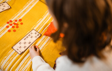 Happy father and child playing board game at home - happiness and family concept.