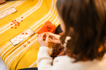 Happy father and child playing board game at home - happiness and family concept.