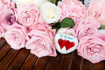Blooming pink rose flowers bouquet with two hearts, Valentine's Day background