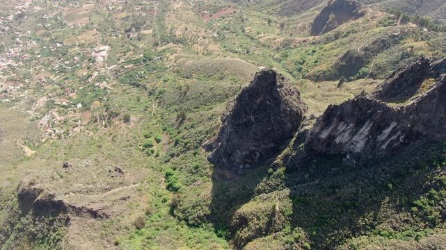 Roque chico and Roque Grande: Drone footage flying over the stunning volcanic formations and green valleys of Gran Canaria island
