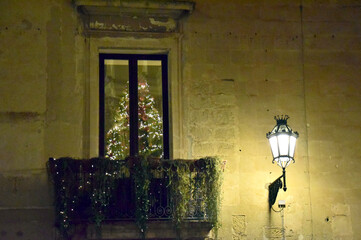 lamp in the wall and Christmas tree