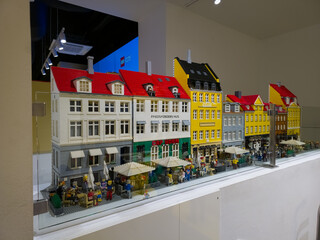Naklejka premium Copenhagen, Denmark - November 3, 2025: Model of the New Harbour Nyhavn at the showroom of the Lego store