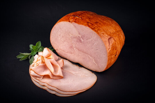 Traditional italian prosciutto arrosto rustico - cooked roasted smoked ham hounch meat cut in this slices