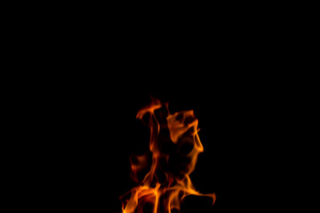 Texture of natural fire at night, on a black background.