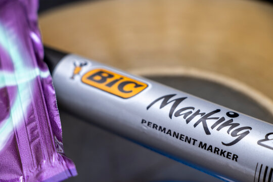 Warsaw, Poland - November 13, 2025: Close-up of a BIC marking permanent marker on a table, showcasing its branding and design, ideal for office or educational settings.