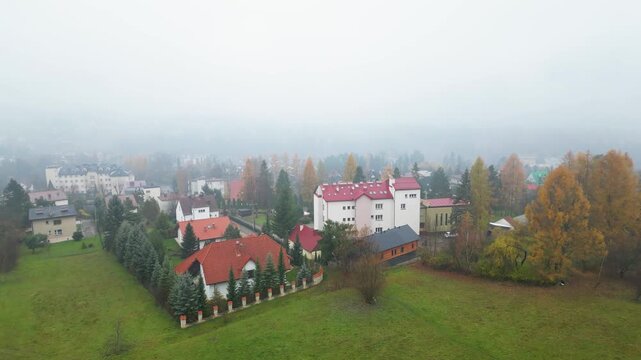 Quiet Suburban District in Fog, Traditional European Houses with Red Tile Roofs. Rabka-Zdr&oacute;j, Poland