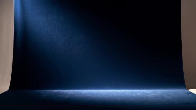 Step into a dramatic setting where a single beam of light breaks through darkness. This video highlights the beauty of contrast and the captivating simplicity of the illuminated space.