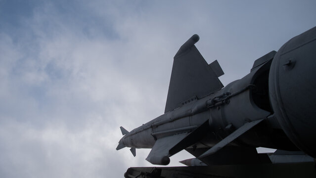 structured scenario showing maintenance crew inspecting missile with technical precision and discipline