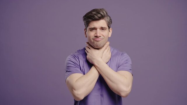 Mature Man Has Sore. Sick Guy With Swollen Throat On Violet Studio. Angina, Pain