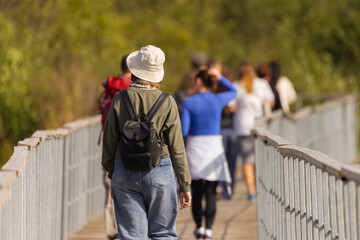 Exploring nature on a sunny day with friends in a scenic outdoor pathway