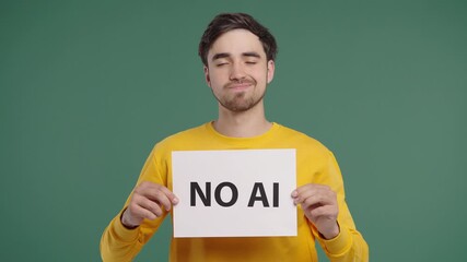 Young Man Holds Sign No Ai With Serious Face In Studio Visual Protest Against 