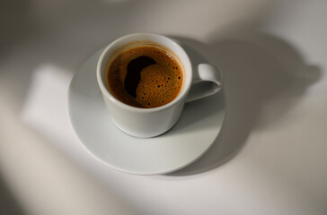 Traditional Turkish coffee in cup on white background