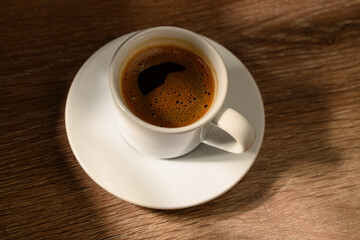  Traditional Turkish coffee in cup on wooden background