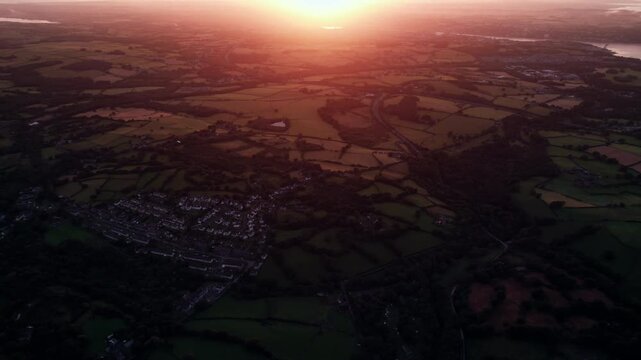 Golden Sunset Over Rural Farmland and Countryside