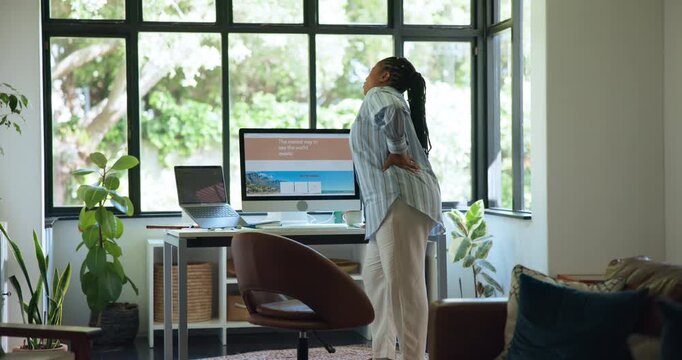 Woman, back pain and injury with muscle tension, overworked strain or bad posture in home. Frustrated, female person or sore spine with massage or stretch for accident or joint inflammation in house